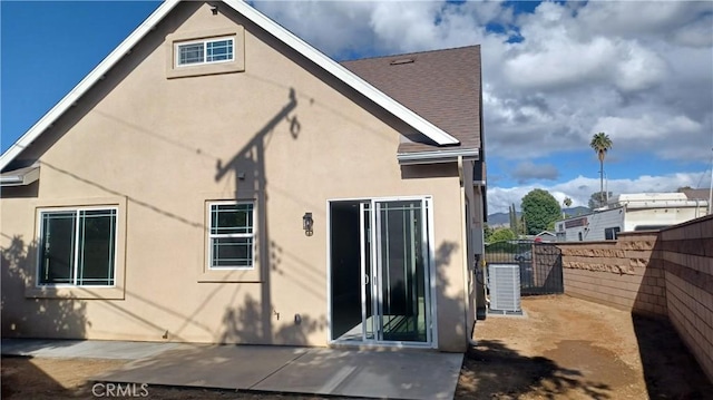 5183 Peony Ct, Riverside, CA 92506 - back of property with a patio area, central air condition unit, stucco siding, and fence