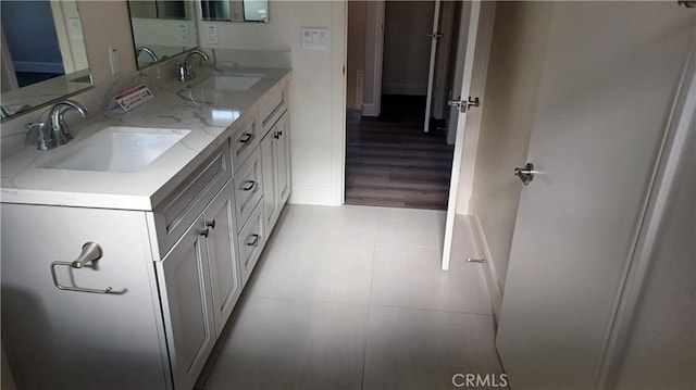 5183 Peony Ct, Riverside, CA 92506 - full bathroom featuring double vanity, a sink, and baseboards