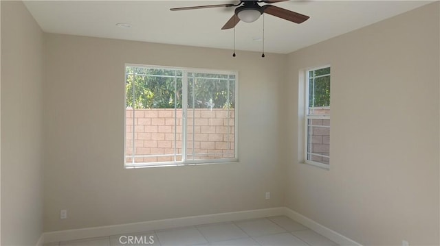 5183 Peony Ct, Riverside, CA 92506 - spare room featuring light tile patterned floors, a ceiling fan, and baseboards