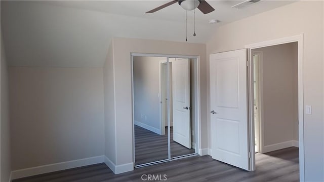 5183 Peony Ct, Riverside, CA 92506 - unfurnished bedroom with dark wood-style flooring, a closet, visible vents, vaulted ceiling, and baseboards