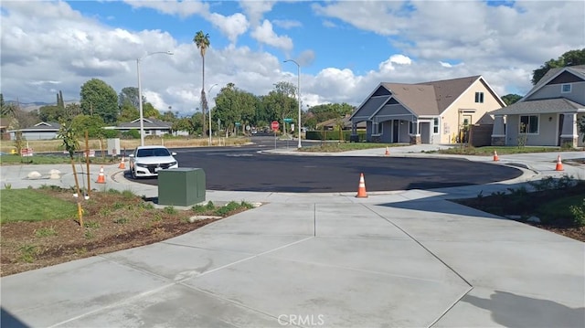 5183 Peony Ct, Riverside, CA 92506 - view of road with concrete driveway and street lights