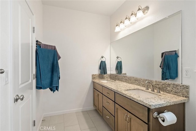 1982 Dawncrest Dr, Chico, CA 95928 - bathroom with double vanity, a sink, tile patterned flooring, and baseboards