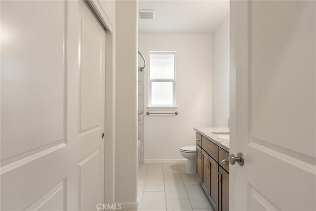 1982 Dawncrest Dr, Chico, CA 95928 - bathroom featuring visible vents, baseboards, toilet, vanity, and tile patterned flooring