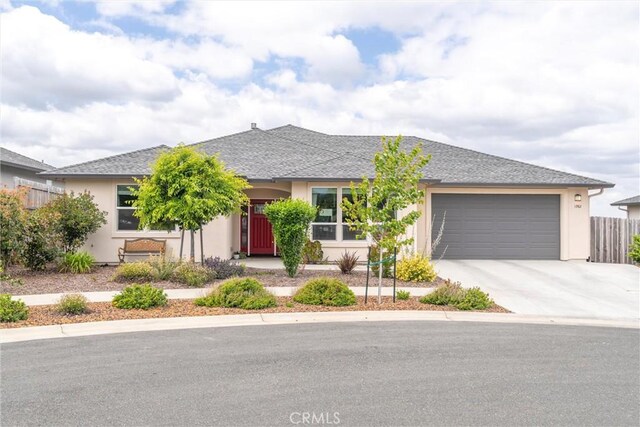 1982 Dawncrest Dr, Chico, CA 95928 - ranch-style house with an attached garage, concrete driveway, stucco siding, and fence