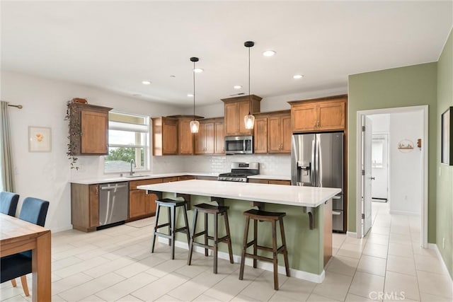 1982 Dawncrest Dr, Chico, CA 95928 - kitchen with stainless steel appliances, light countertops, brown cabinets, backsplash, and a sink
