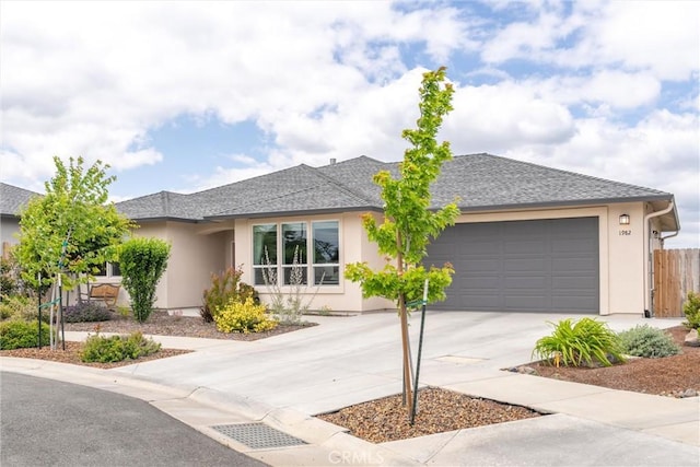 1982 Dawncrest Dr, Chico, CA 95928 - ranch-style house featuring fence, concrete driveway, a shingled roof, an attached garage, and stucco siding