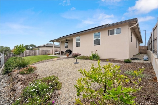 1982 Dawncrest Dr, Chico, CA 95928 - rear view of property with stucco siding, ceiling fan, a patio, and a fenced backyard