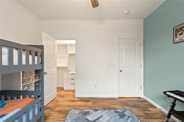 1982 Dawncrest Dr, Chico, CA 95928 - unfurnished bedroom with baseboards, a spacious closet, and wood finished floors
