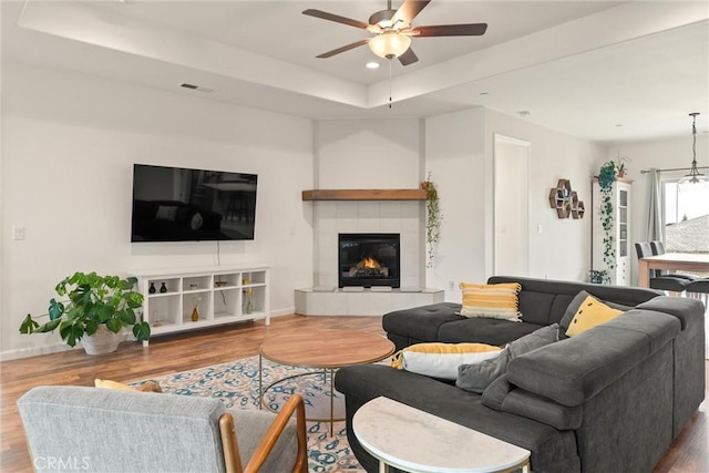 1982 Dawncrest Dr, Chico, CA 95928 - living room with recessed lighting, a tile fireplace, ceiling fan, a raised ceiling, and wood finished floors