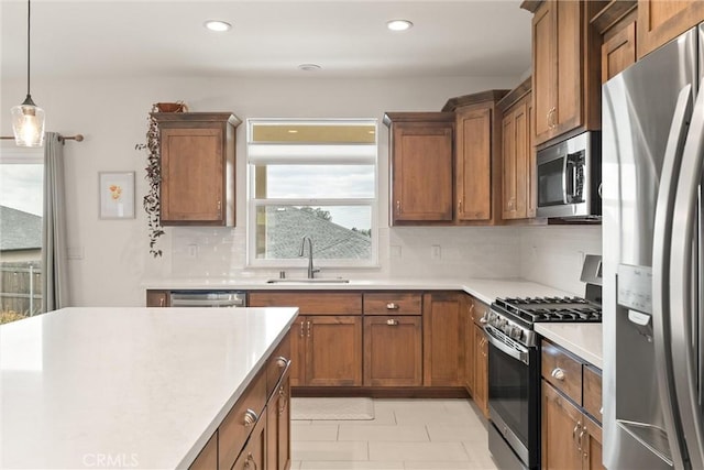 1982 Dawncrest Dr, Chico, CA 95928 - kitchen with brown cabinets, tasteful backsplash, a sink, appliances with stainless steel finishes, and light countertops