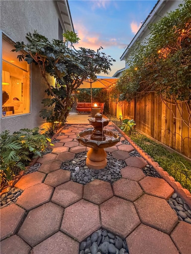 view of patio featuring fence