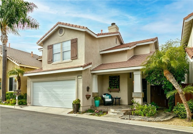 view of front of property with a porch, an attached garage, stucco siding, and a chimney