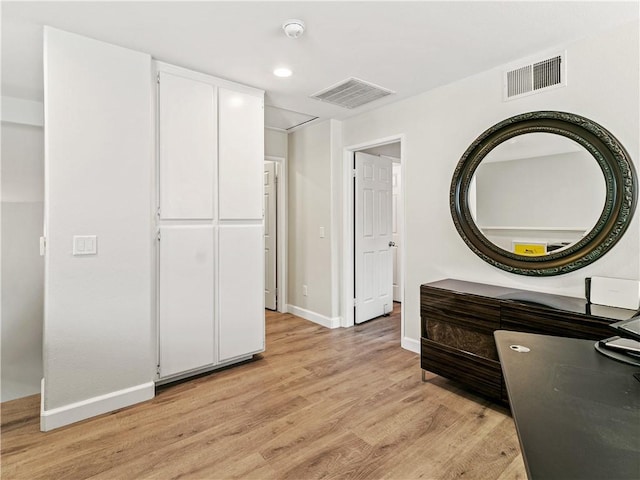 interior space with light wood-style floors, baseboards, recessed lighting, and visible vents