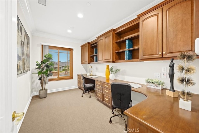 home office featuring recessed lighting, light colored carpet, ornamental molding, built in study area, and baseboards