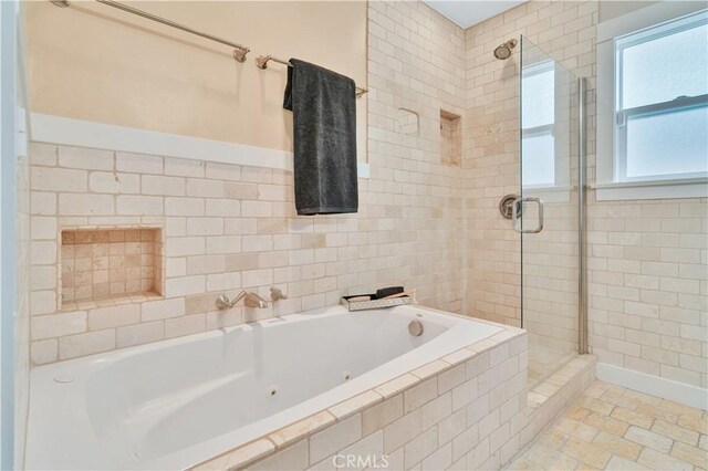 full bathroom with a whirlpool tub and a stall shower