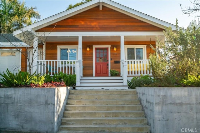 view of front of property featuring covered porch