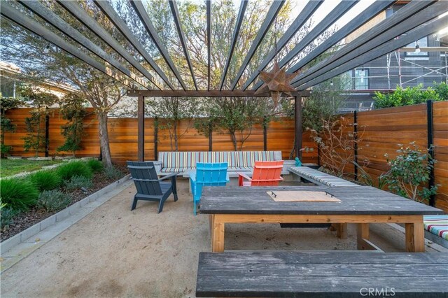 view of patio / terrace featuring a pergola, outdoor dining area, and a fenced backyard