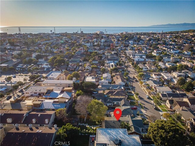birds eye view of property featuring a residential view and a water view