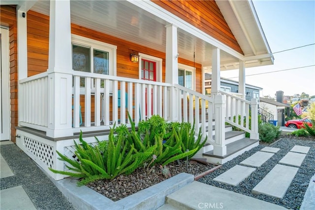 view of property exterior with a porch