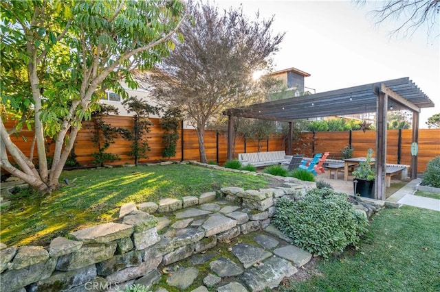view of yard featuring a patio, a pergola, and a fenced backyard