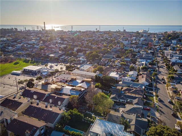 drone / aerial view with a water view and a residential view