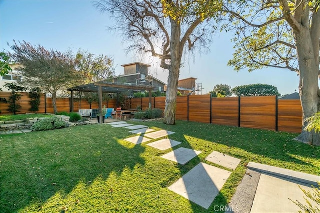 view of yard with outdoor lounge area, a gazebo, a fenced backyard, and a patio area