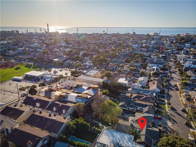 birds eye view of property featuring a residential view and a water view