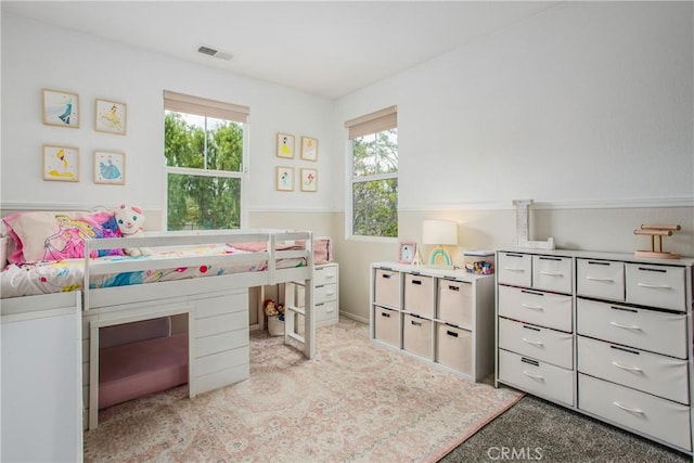 bedroom with carpet and visible vents