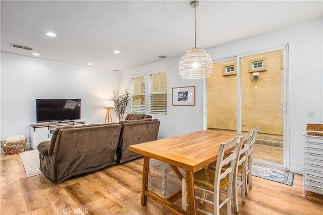 dining room with recessed lighting, visible vents, and light wood-style flooring