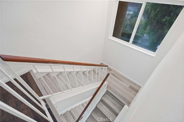 stairs featuring baseboards