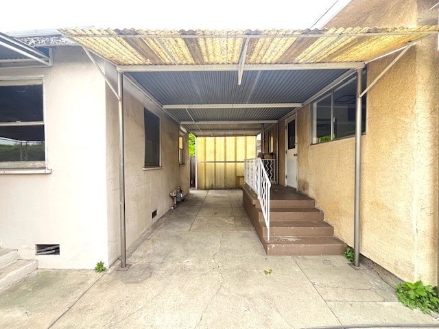 1911 Griffin Ave, Los Angeles, CA 90031 - exterior space with stucco siding, an attached carport, and crawl space