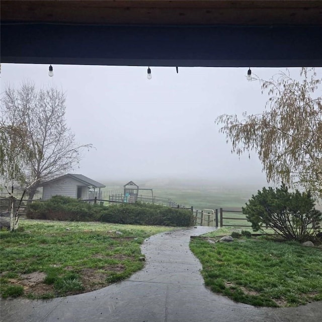 view of community featuring fence