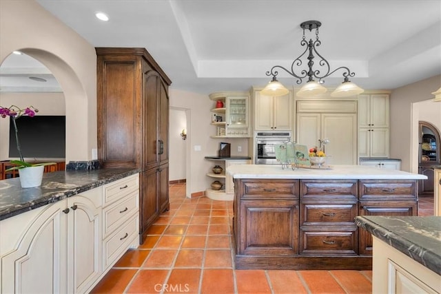 2839 Via Victoria, Palos Verdes Estates, CA 90274 - kitchen with stainless steel oven, cream cabinetry, open shelves, a raised ceiling, and hanging light fixtures