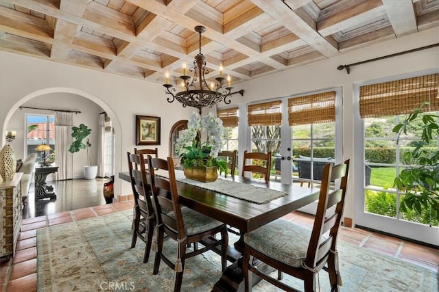 2839 Via Victoria, Palos Verdes Estates, CA 90274 - tiled dining room featuring arched walkways, french doors, beamed ceiling, coffered ceiling, and a chandelier