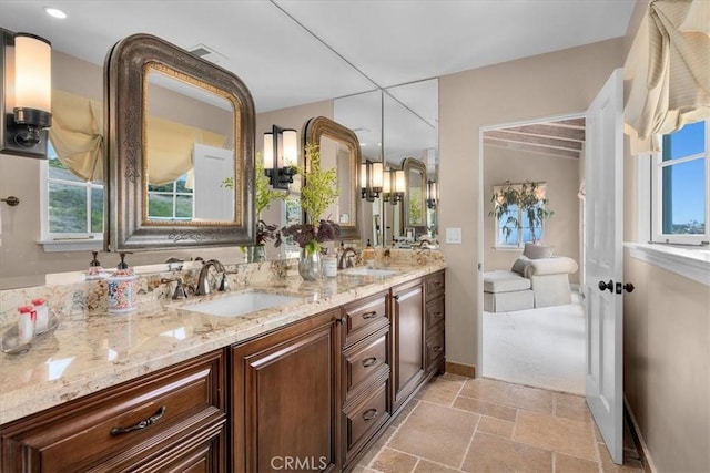 2839 Via Victoria, Palos Verdes Estates, CA 90274 - bathroom with double vanity, baseboards, and stone tile floors