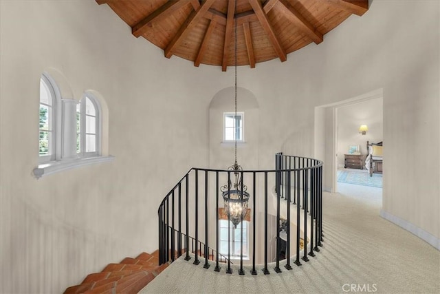 2839 Via Victoria, Palos Verdes Estates, CA 90274 - staircase with wooden ceiling, high vaulted ceiling, beamed ceiling, carpet flooring, and a chandelier