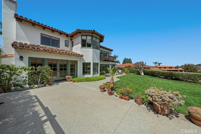 2839 Via Victoria, Palos Verdes Estates, CA 90274 - back of house with french doors, a yard, stucco siding, and a balcony
