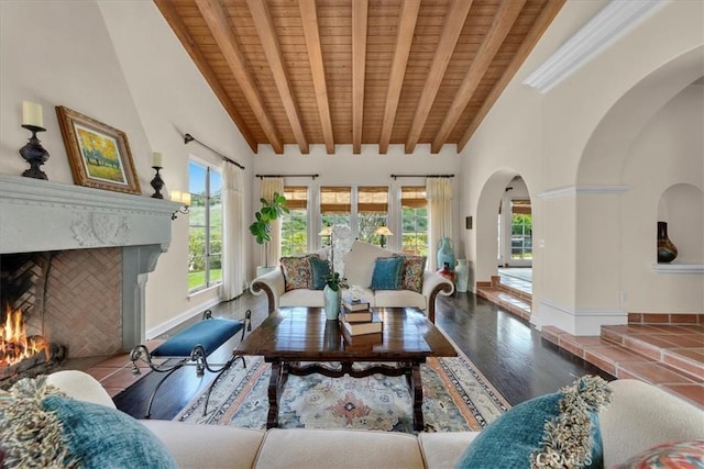 2839 Via Victoria, Palos Verdes Estates, CA 90274 - living area with arched walkways, wood ceiling, a high end fireplace, wood finished floors, and beam ceiling