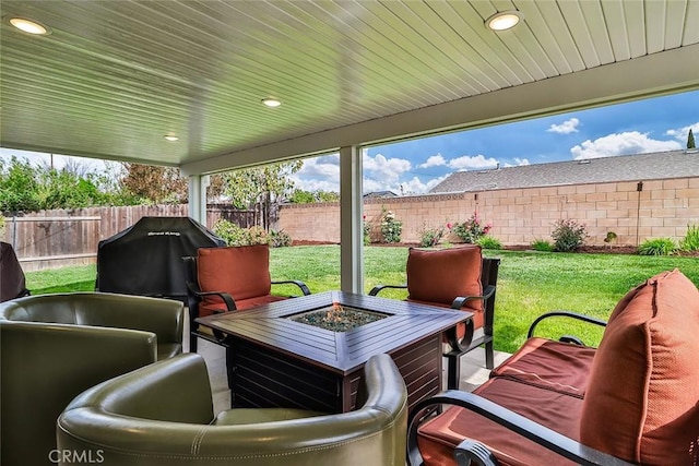 view of patio / terrace featuring a fenced backyard and an outdoor fire pit