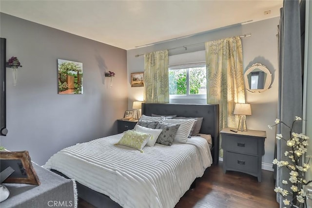 bedroom featuring dark wood-type flooring