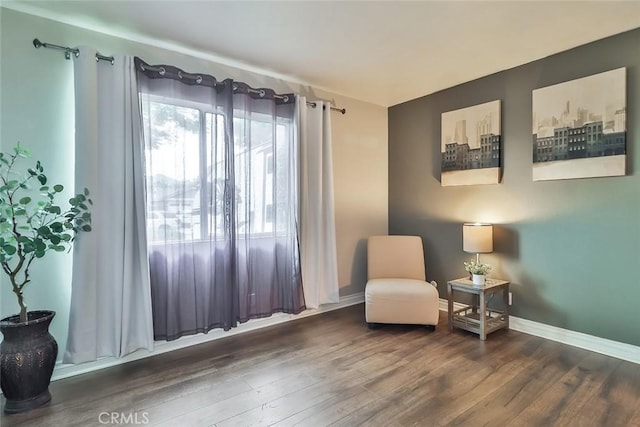 sitting room featuring wood finished floors and baseboards