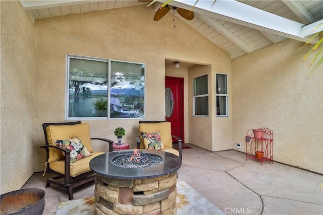 view of patio with an outdoor fire pit and ceiling fan