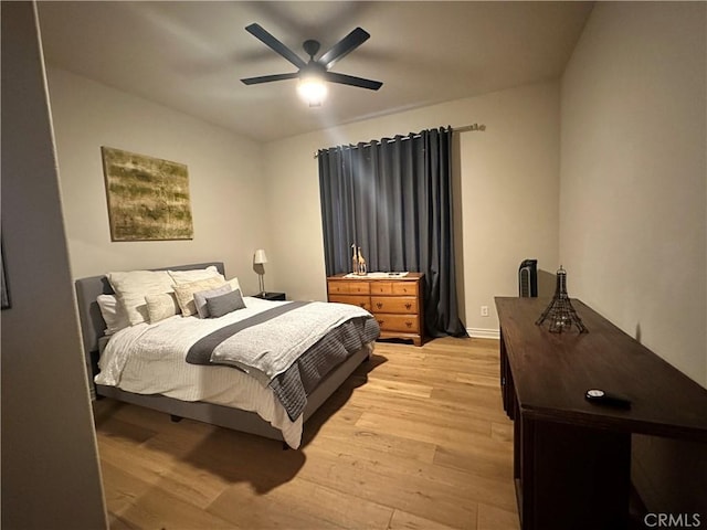 bedroom with light wood-style floors and ceiling fan