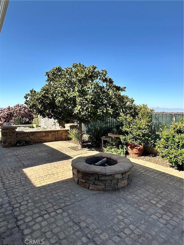 view of patio / terrace with a fire pit