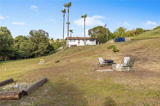 view of yard with an outdoor fire pit