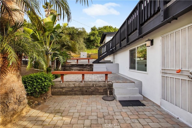 view of patio featuring stairs