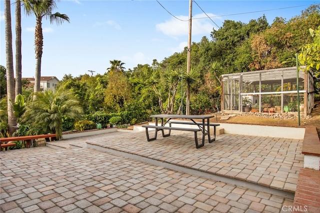 view of patio / terrace with a sunroom
