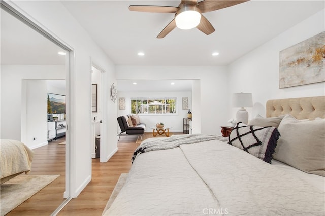 bedroom featuring recessed lighting, light wood finished floors, a ceiling fan, and baseboards