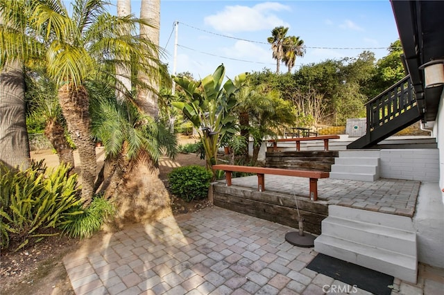 view of patio / terrace featuring stairs