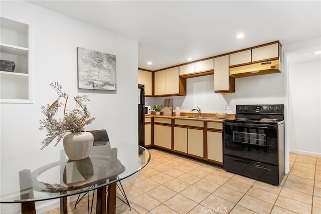 kitchen with light tile patterned floors, black appliances, under cabinet range hood, and recessed lighting